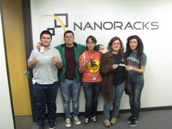 The South Houston High School team pose with their NanoRacks-SHHS-Polyurethane Repair Kit experiment at the NanoRacks facility.